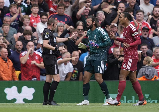Liverpool goalkeeper Alisson protests to referee Sam Barrott after he awarded a penalty to Nottingham Forest
