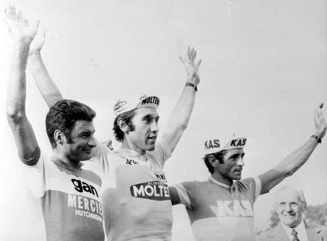 Eddy Merckx, centre, celebrates winning the yellow jersey in 1974