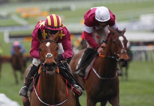 Minella Indo (left) winning the Albert Bartlett Novices' Hurdle 