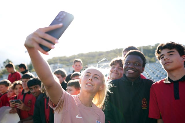 England’s Chloe Kelly stopped for photos with fans after a training session at Central Coast Stadium 