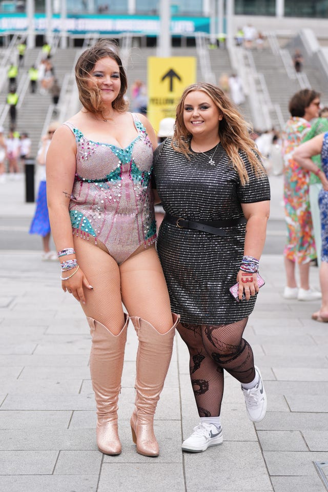 Katie Jackson, 18, wearing a homemade Taylor Swift bodysuit, and Kacey Tinsley, 20, pose for a photo outside Wembley Stadium