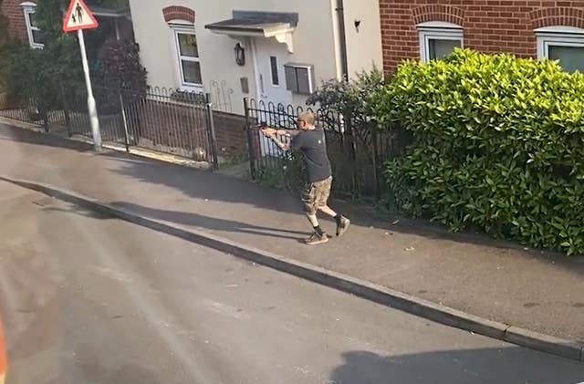CCTV image of Jason King with the crossbow before being shot by police