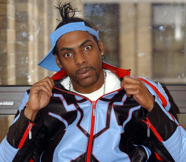 Coolio wears a blue tracksuit during a photoshoot