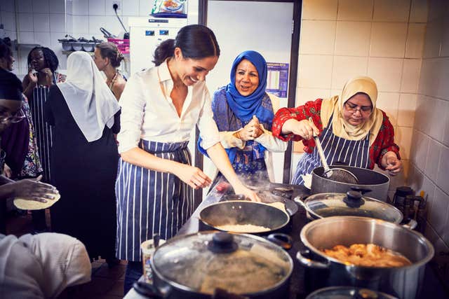 Meghan cooking with women in the Hubb Community Kitchen in west London