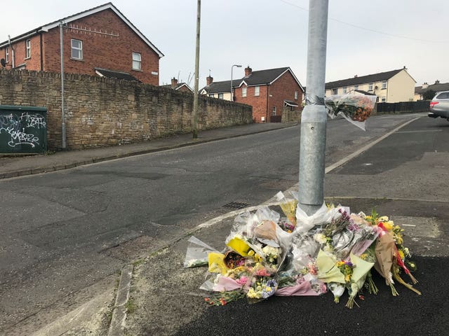 Flowers remain at the spot where Lyra McKee was killed in Creggan, Londonderry