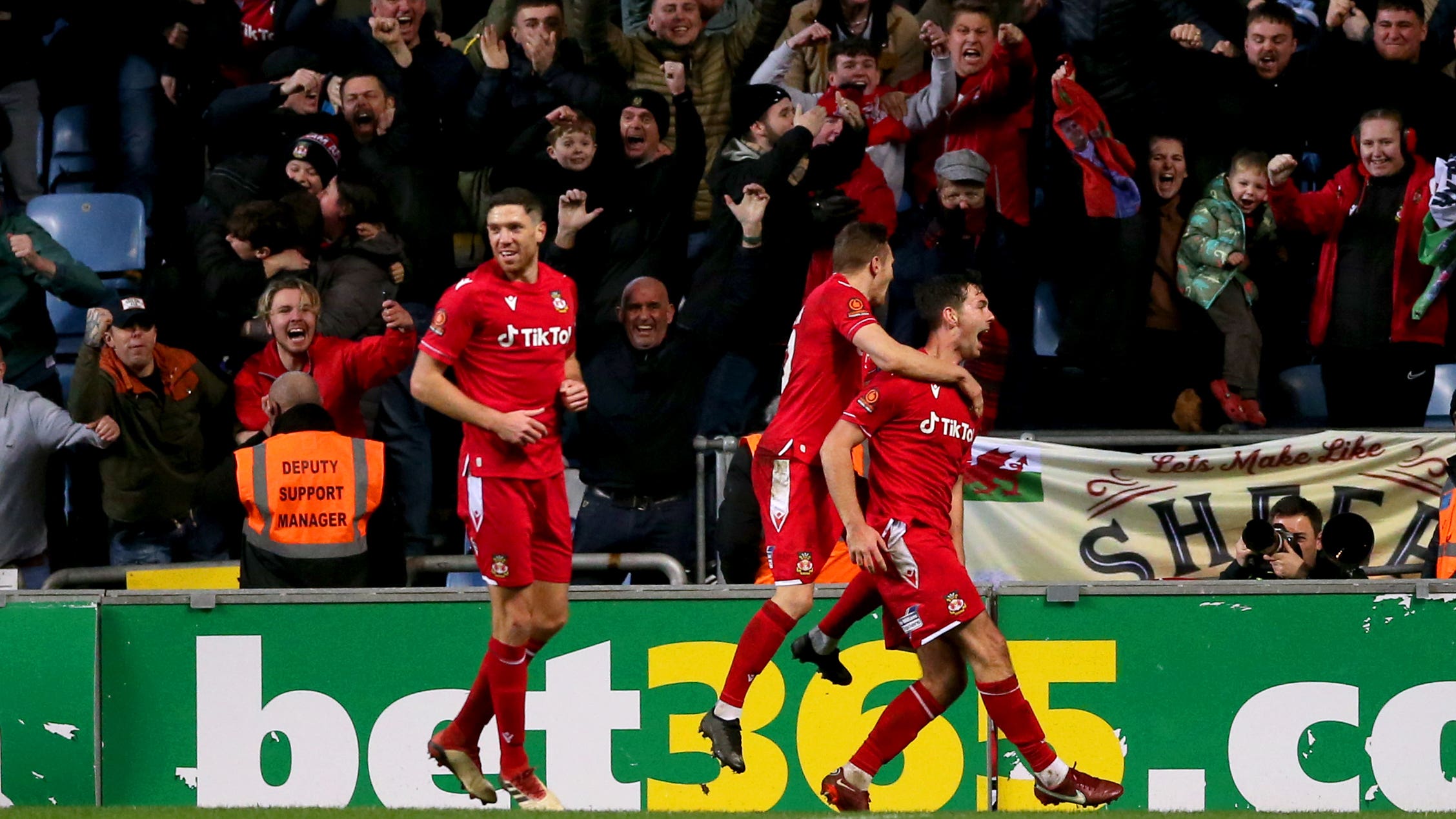 Wrexham’s Thomas O’Connor (right) celebrates scoring their side’s third goal of the game during the Emirates FA Cup third round match at the Coventry Building Society Arena, Coventry. Picture date: Saturday January 7, 2023.
