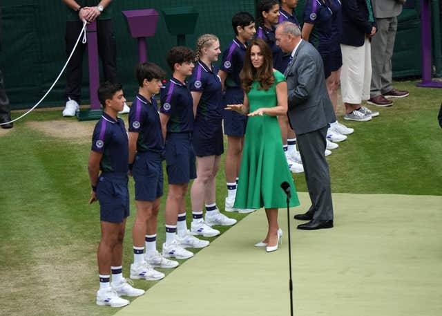 Kate greets ball boys and girls before handing out the Ladies’ Singles trophy in 2021