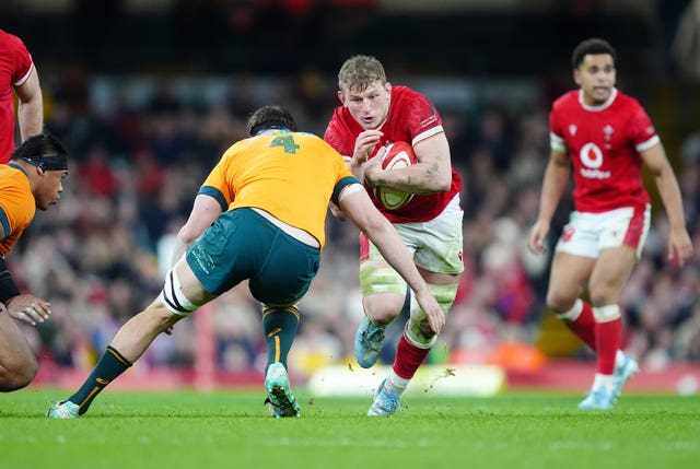 Wales’ Jac Morgan, centre, is tackled by Australia’s Nick Frost, left