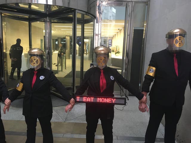 Environment protesters from Extinction Rebellion glue themselves to London Stock Exchange