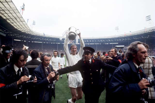Jack Charlton celebrates with the FA Cup after Leeds' victory in 1972 