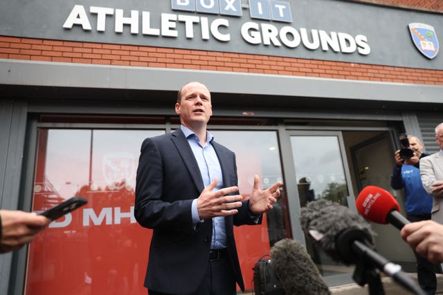 DUP Sports Minister Gordon Lyons speaks to the media outside the Athletic Grounds (Peter Morrison/PA)