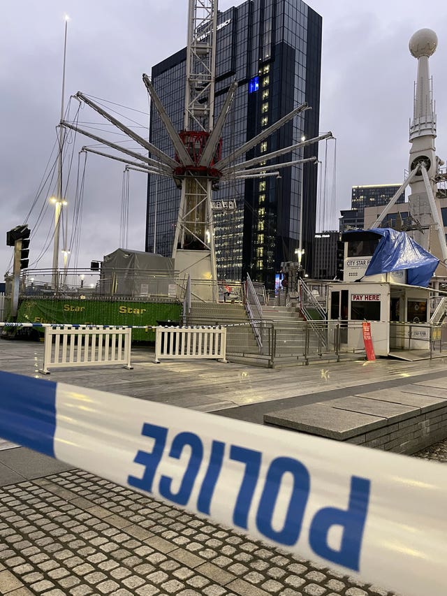 Police tape in front of a fairground ride