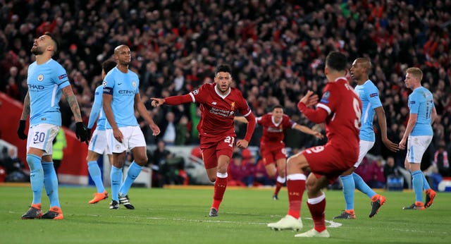 Liverpool's Alex Oxlade-Chamberlain celebrates scoring against Manchester City in a Champions League quarter-final