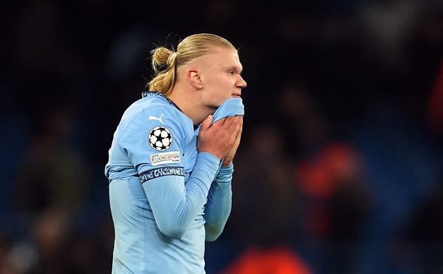 Manchester City's Erling Haaland lifts his shirt to his chin as he reacts following the final whistle against Feyenoord