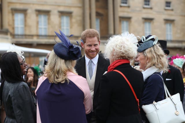 The Duke of Sussex in conversation with guests during a Royal Garden Party. Yui Mok/PA Wire