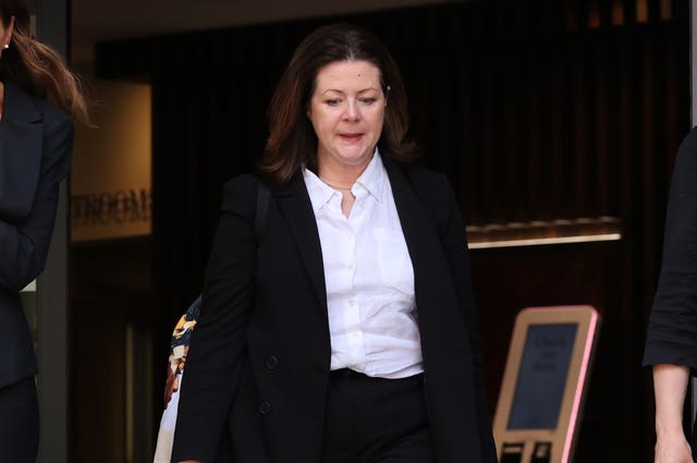 Brenda Campbell exiting a building