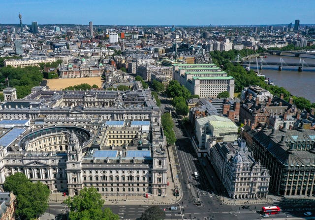 An aerial view of London showing the view along Parliament Street to the Cenotaph and Whitehall, from the junction with Great George Street, with (left) government buildings which house departments including: The Treasury, the Department for Digital, Culture, Media and Sport, HMRC, the Foreign and Commonwealth Office, Downing Street, the Cabinet Office and Horse Guards Parade, and (right) the Ministry of Defence, the Old War Office Building and the Department for International Trade