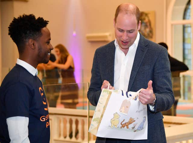 Prince William receives a gift for his new baby (Toby Melville/PA)