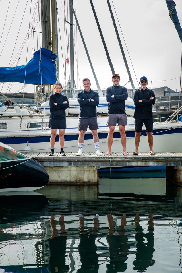 The ROW4MND team pose on a jetty in Cornwall ahead of their challenge