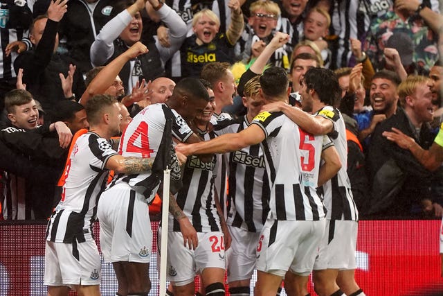 Miguel Almiron, centre, and Newcastle celebrate a Champions League goal against Paris St Germain