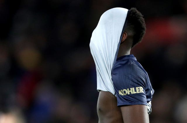 Paul Pogba leaves the pitch with his shirt over his head after Manchester United's 2-2 draw at Southampton.