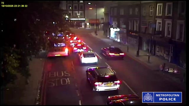 CCTV footage of the BMW being driven on the wrong side of the road past cars stopped at traffic lights in London