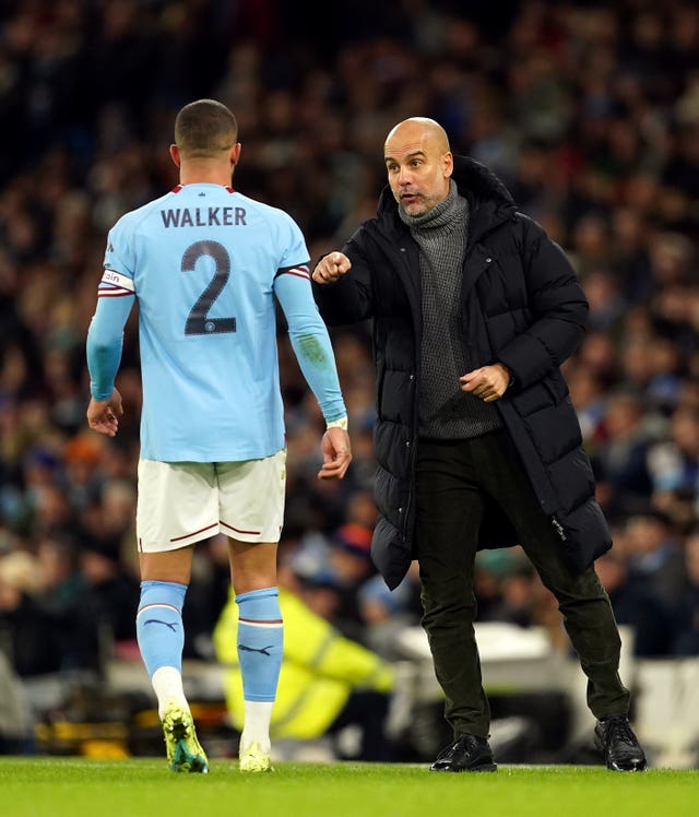 Manchester City manager Pep Guardiola, right, speaks to Kyle Walker during the FA Cup game against Chelsea