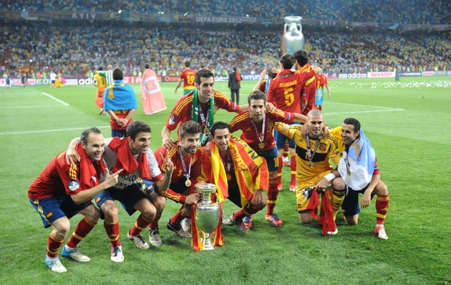 Andres Iniesta and Cesc Fabregas (first and second left) celebrate winning Euro 2012