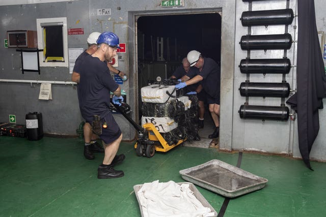 Suspected drugs being loaded onto support ship RFA Argus in the Caribbean Sea 