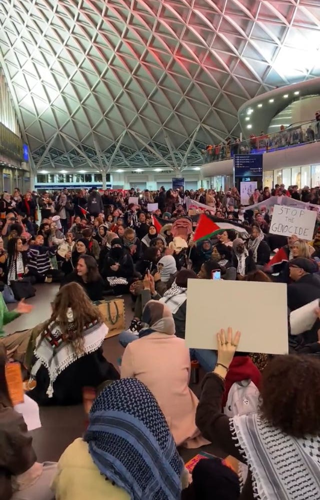 Handout video grab image courtesy of Lukas Slothuus of a pro-Palestinian sit-in at King’s Cross station in London