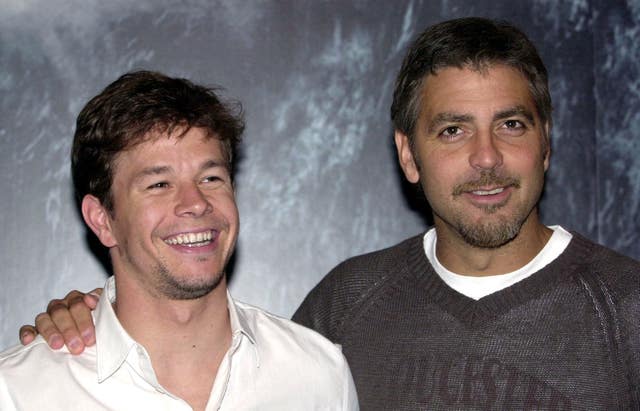 American actors George Clooney (R) and Mark Wahlberg attending the UK premiere of The Perfect Storm