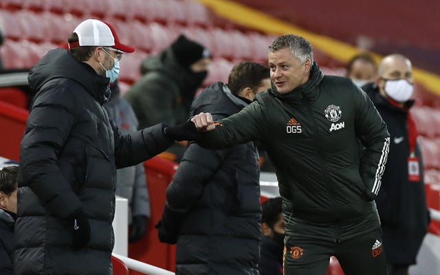 Liverpool manager Jurgen Klopp (left) and Manchester United manager Ole Gunnar Solskjaer bump fists 