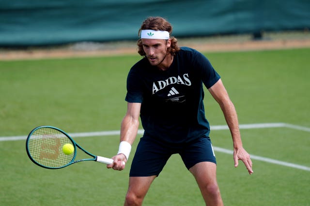 Stefanos Tsitsipas hits a forehand in practice at Wimbledon