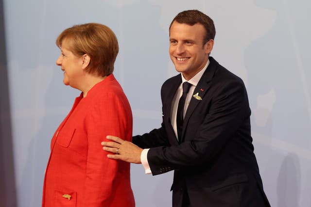 Angela Merkel and Emmanuel Macron (Matt Cardy/PA)