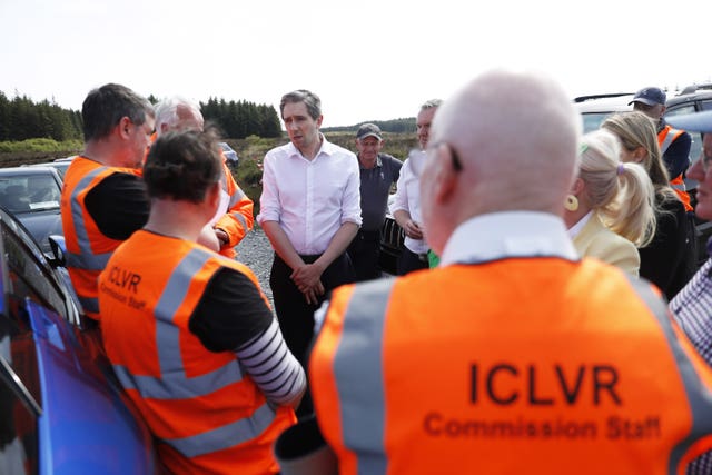 Minister of Justice Simon Harris, (centre), talks with members of the Independent Commission for the Location of Victims’ Remains (ICLVR), during a visit to the remote Bragan Bog in Co Monaghan where a painstaking dig for missing teenager Columba McVeigh is ongoing. Mr McVeigh, 19, from Donaghmore in Co Tyrone, was murdered and secretly buried by the IRA in 1975