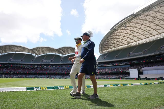 Australia’s Nathan Lyon (left) walks off the ground after picking up an injury (Robbie Stephenson/PA)