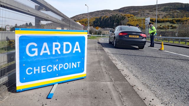 Gardai man a checkpoint on the border with Northern Ireland at Carrickarnon, Co Louth 