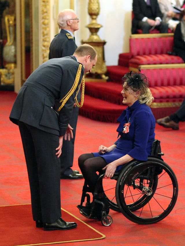 Claire Lomas is made an MBE by the Duke of Cambridge at Buckingham Palace.