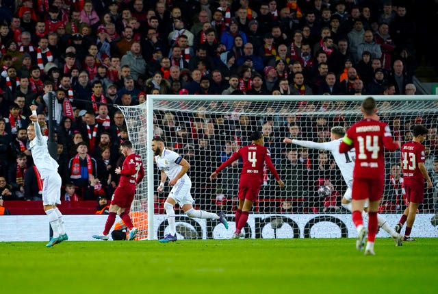 Karim Benzema, centre left, celebrates scoring Real Madrid’s fifth goal against Liverpool