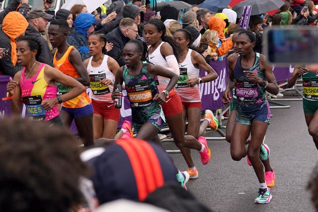 Athletes in the Women’s elite race cross Tower Bridge