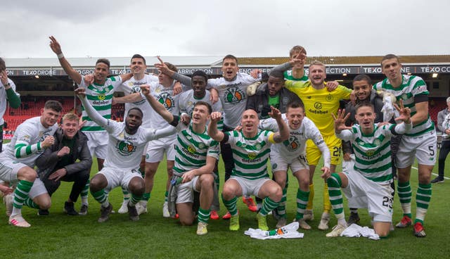 Celtic players celebrate winning the Scottish Premiership at Aberdeen 