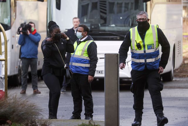 Passengers arrive at a Holiday Inn near Heathrow Airport, where they will remain during a 10 day quarantine period after returning to England from one of 33 “red list” countries