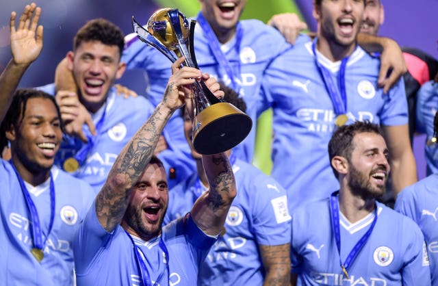 Manchester City’s Kyle Walker lifts the trophy after victory in the Club World Cup final in 2023