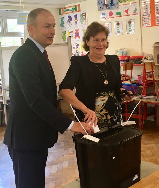 Micheal Martin and his wife Mary voting in Cork (Handout/PA)