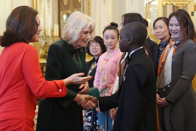 Camilla meeting essay competition winners and runners-up during the reception at Buckingham Palace