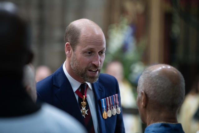 The Prince of Wales chats to the congregation at a Service of Thanksgiving at Westminster Abbey in London on the 80th anniversary of VE Day