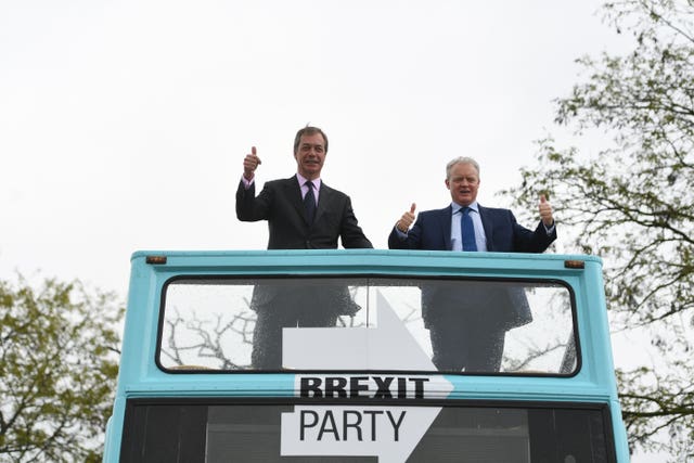Nigel Farage (left) standing with Mike Greene during the announcement in Peterborough