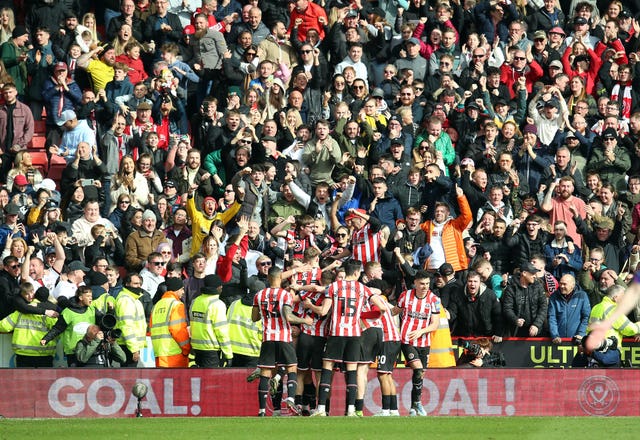 Tommy Doyle celebrates his winner in front of the Sheffield United fans 