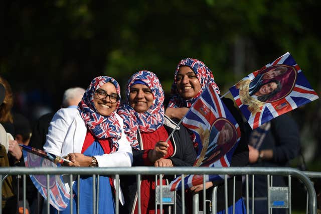 Royal fans gather behind the barriers on the Long Walk, in Windsor (Oli Scarff/PA)