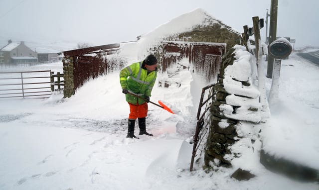 Man clears snow